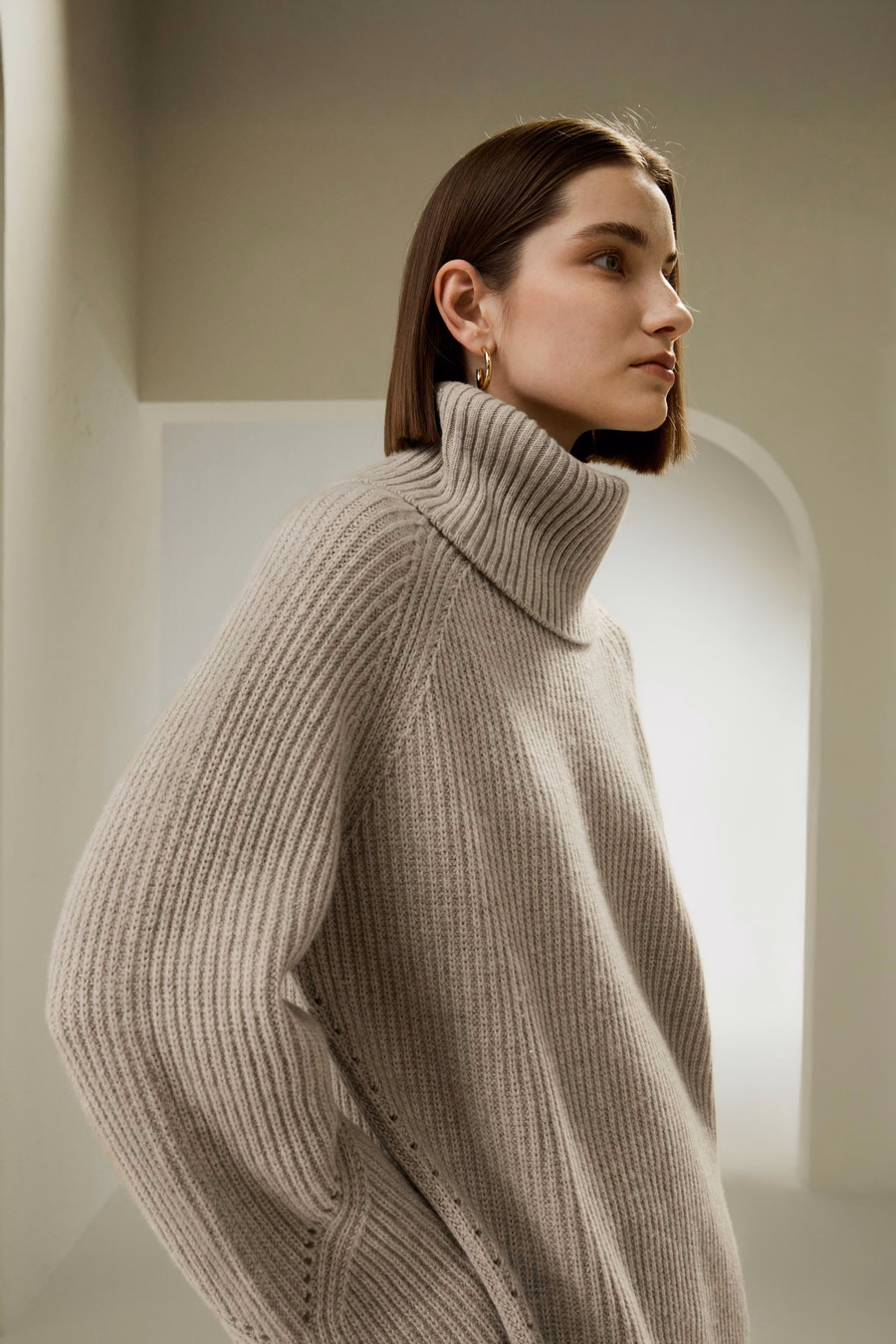 Maglione oversize in lana merino con maniche a fessura